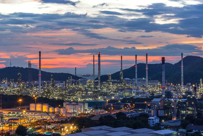 High angle view of illuminated buildings against sky during sunset