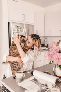 Woman with cat at home