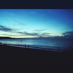 Scenic view of sea against sky at sunset