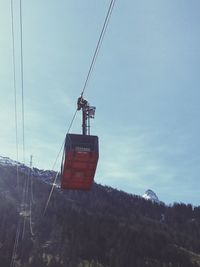 Overhead cable car against sky