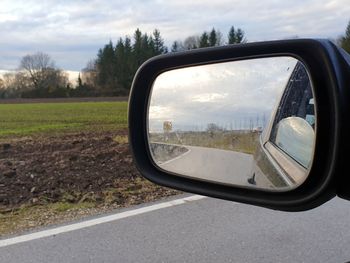 Reflection of road on side-view mirror