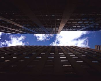 Low angle view of building against cloudy sky