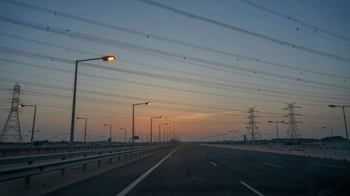 Road against sky at sunset