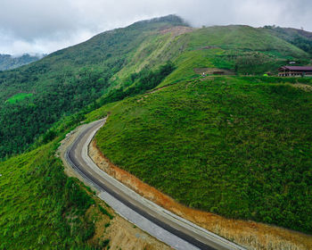 High angle view of road amidst mountains against sky, salena top palu