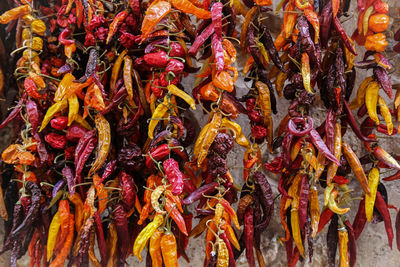Close-up of dry chillies for sale at market stall
