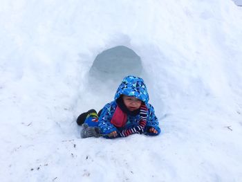 Fallen boy crying on snow