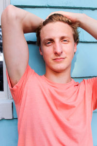 Portrait of young man standing outdoors