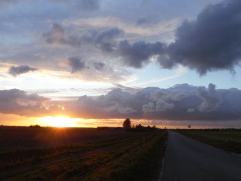 Country road passing through field