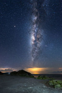 Scenic view of sea against sky at night