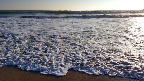 Scenic view of sea against sky at sunset