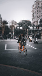 Man riding motorcycle on city street