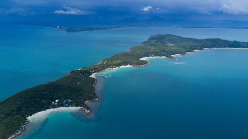 Aerial view of sea and mountains against sky