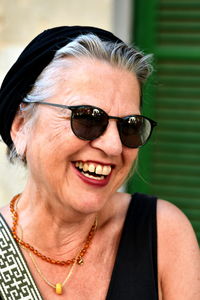 Portrait of young woman wearing sunglasses