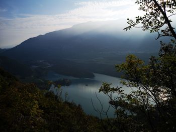 Scenic view of lake and mountains against sky