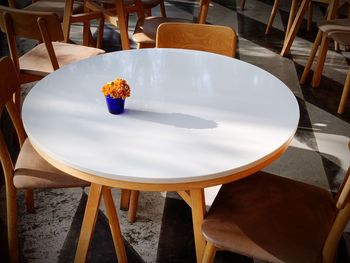 High angle view of empty chairs and table in restaurant