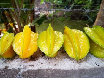 Close-up of yellow fruits on wood