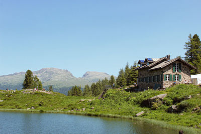 Scenic view of mountains against clear blue sky