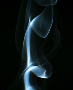 Close-up of smoke against black background