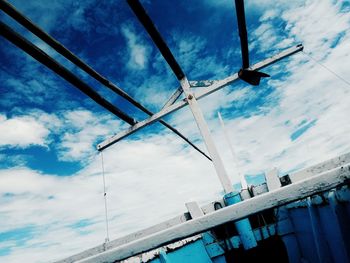 Low angle view of cables against sky