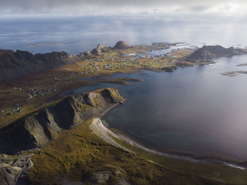 Aerial view of rocks on beach against sky