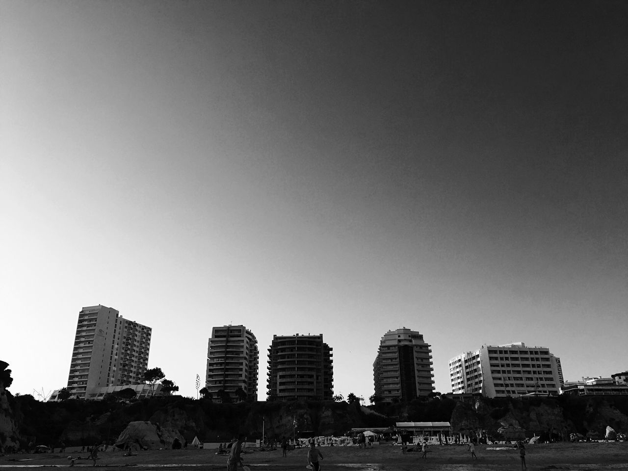 architecture, built structure, building exterior, clear sky, city, copy space, low angle view, modern, city life, skyscraper, urban skyline, outdoors, day, development, building story, growth, office building, tall - high