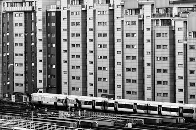High angle view of train against buildings in city
