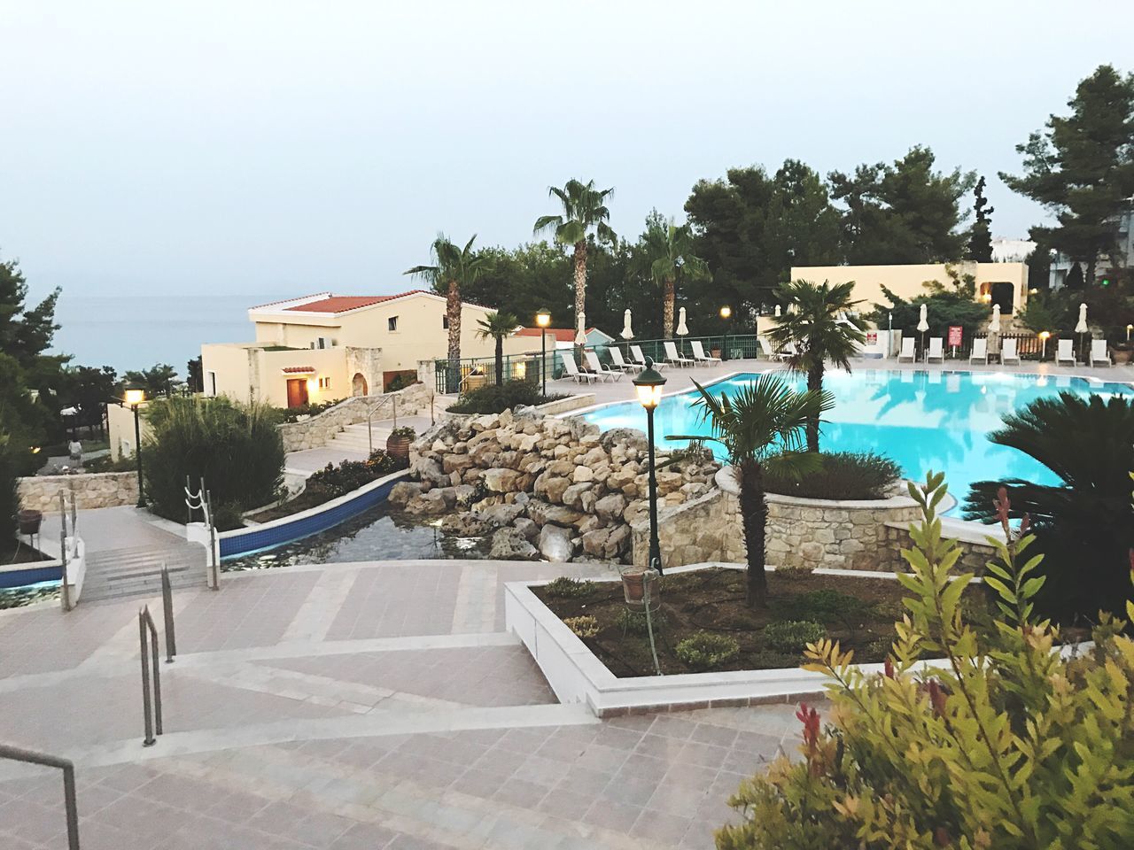 VIEW OF SWIMMING POOL BUILDING AGAINST SKY