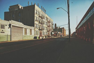 Road along buildings in city