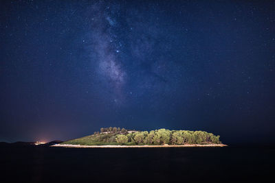 Scenic view of sea against sky at night