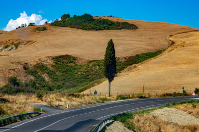 Road amidst landscape against sky