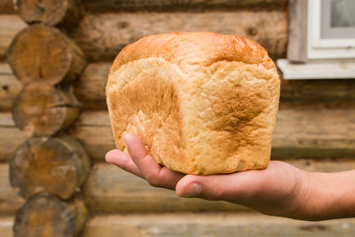 Close-up of hand holding bread