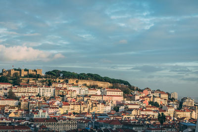 Houses in a city against sky