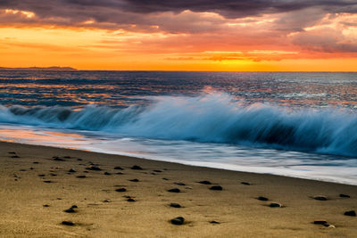 Scenic view of sea against sky during sunset