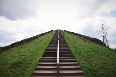 Low angle view of steps on mountain against sky