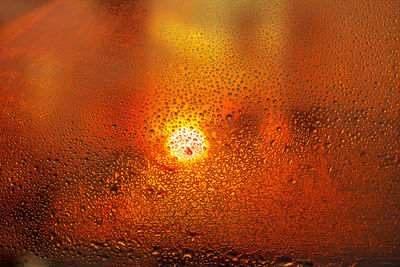 Full frame shot of wet glass window during rainy season