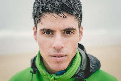 Close-up portrait of man during rainy season