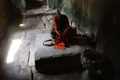 High angle view of man sitting in temple