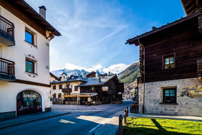 Street amidst buildings in city against sky