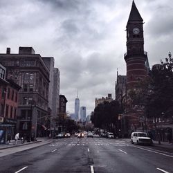 City street against cloudy sky