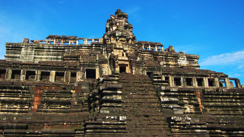 Low angle view of temple against blue sky