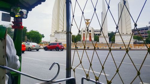Road in city against sky