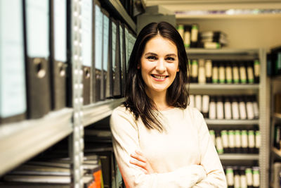 Portrait of smiling young woman standing outdoors