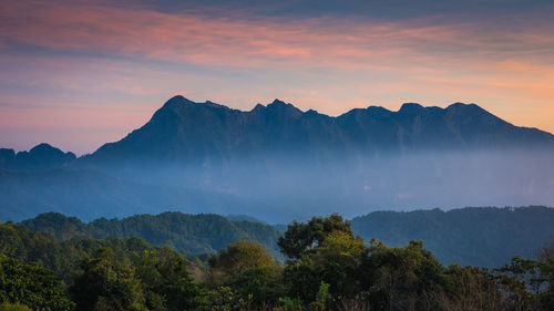 Scenic view of mountains against sky during sunset