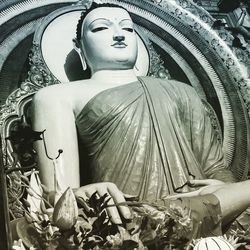 Low angle view of buddha statue