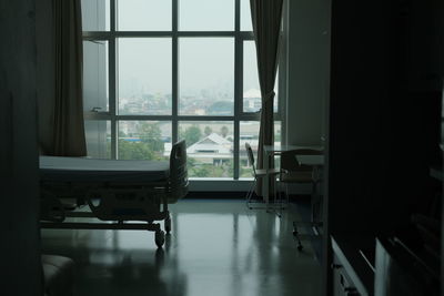 Empty chairs and table in building