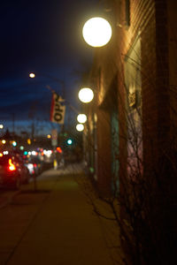 Illuminated street light at night