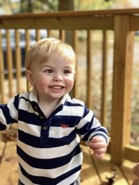 Happy toddler boy in autumn