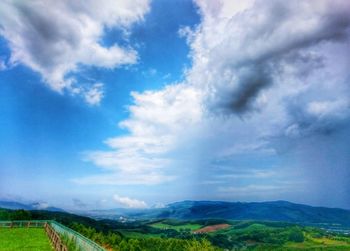 Scenic view of agricultural field against sky