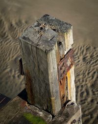 Close-up of old wooden post