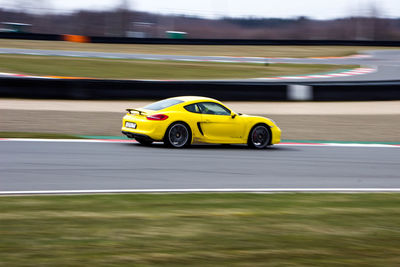 Yellow car on road